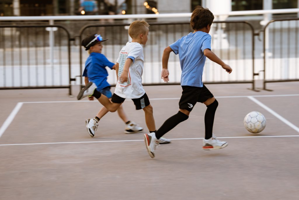 Children play soccer at the Open Streets festival in downtown Salt Lake City.
